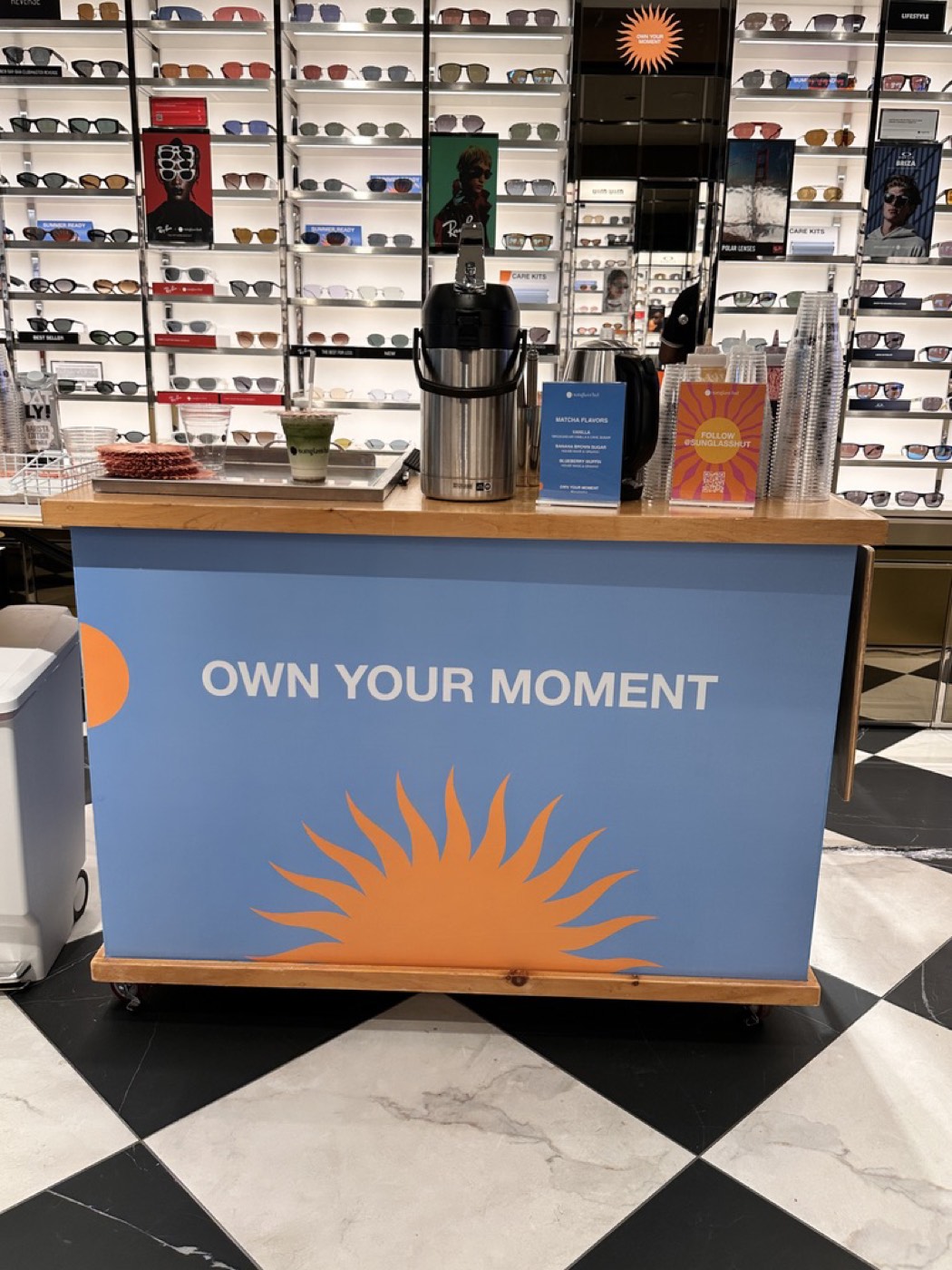 The Silk Road bar wrapped in Sunglass Hut&rsquo;s Own Your Moment branding at Lenox Square